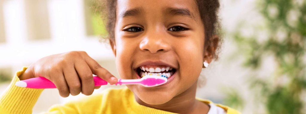 cavity prevention - little girl brushing teeth