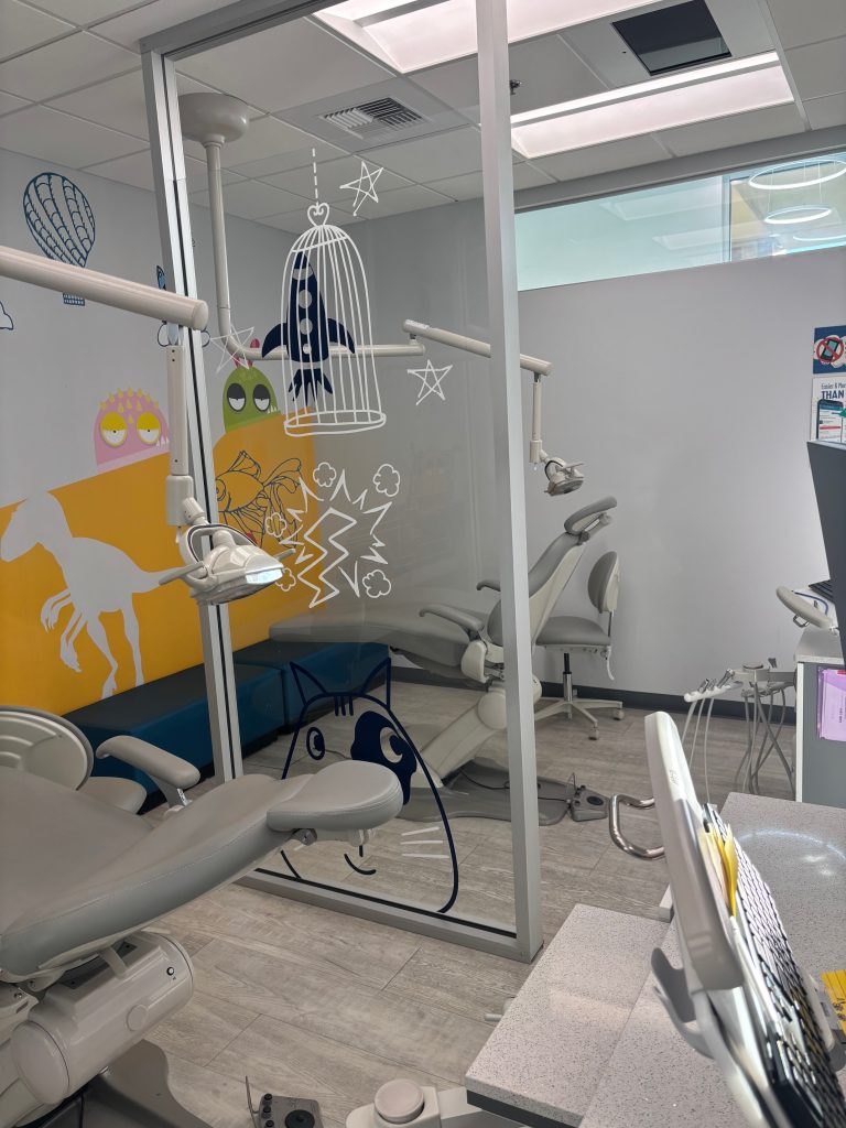 modesto-pediatric-dentist-kids-care-dental-treatment-area Treatment area with patient chairs inside Kids Care Dental & Orthodontics in Modesto, CA