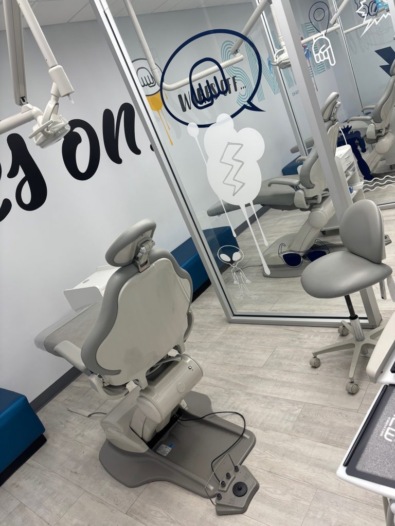 modesto-pediatric-dentist-kids-care-dental-treatment-2 Exam room with patient chair inside Kids Care Dental & Orthodontics in Modesto, CA