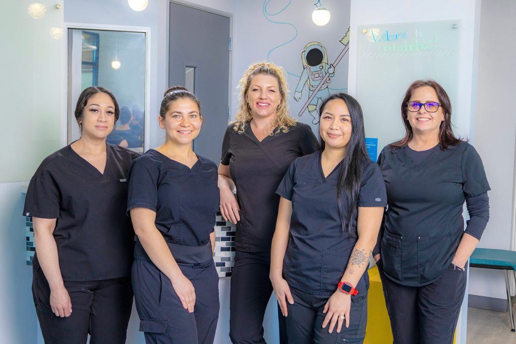 Group photo of team members at Kids Care Dental & Orthodontic