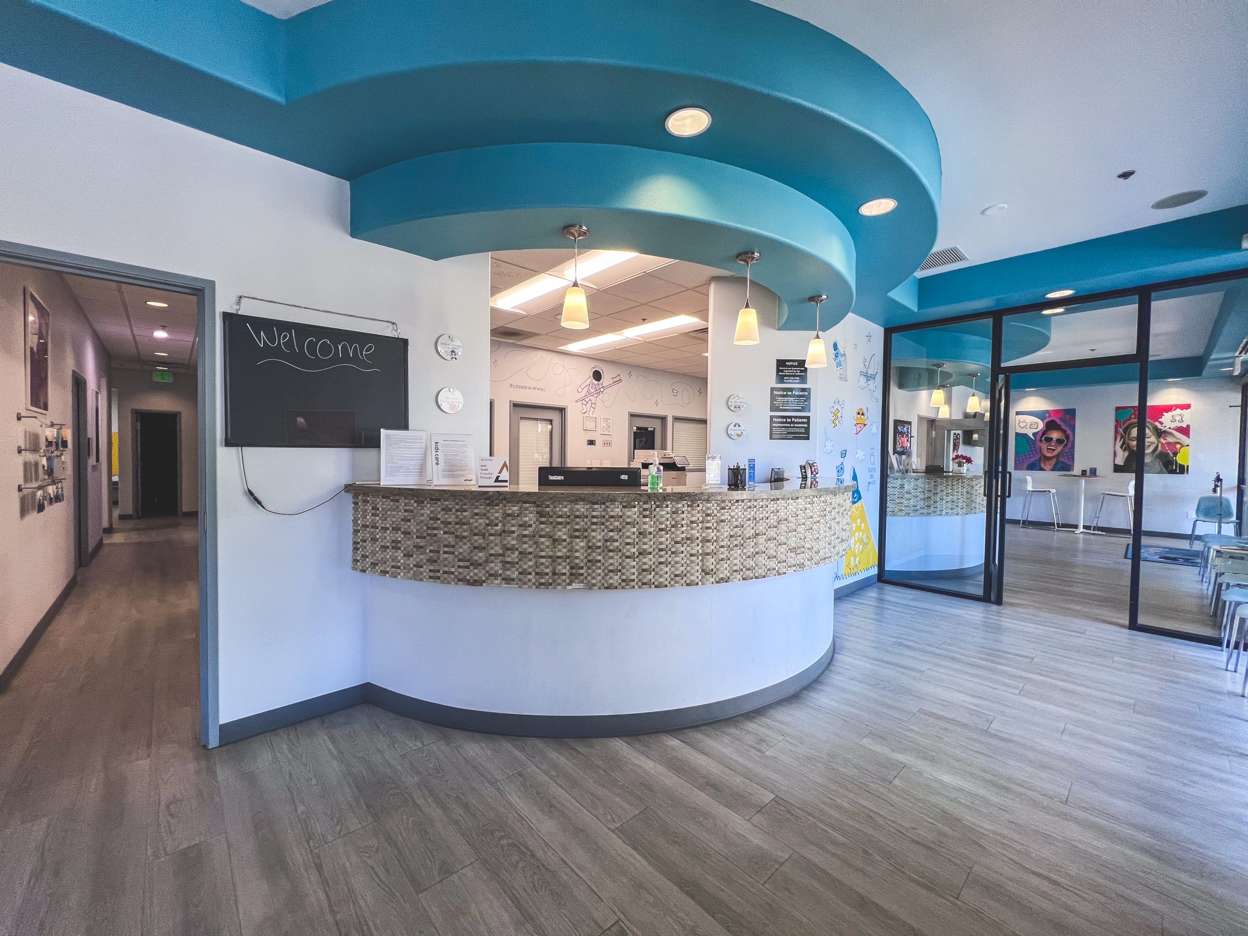 Pediatric dental and orthodontic office lobby with open reception space and welcoming atmosphere for children and parents