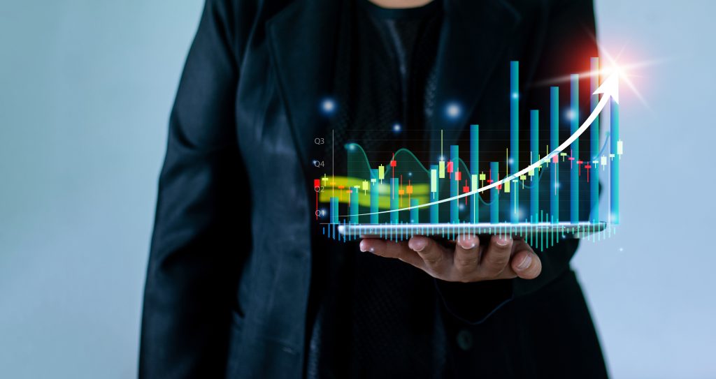 Businesswoman hand holding virtual hologram tablet. technology, finance, business and investment concept. Stock Market Investment Funds and Digital. Assets business analyzing financial data trading graph