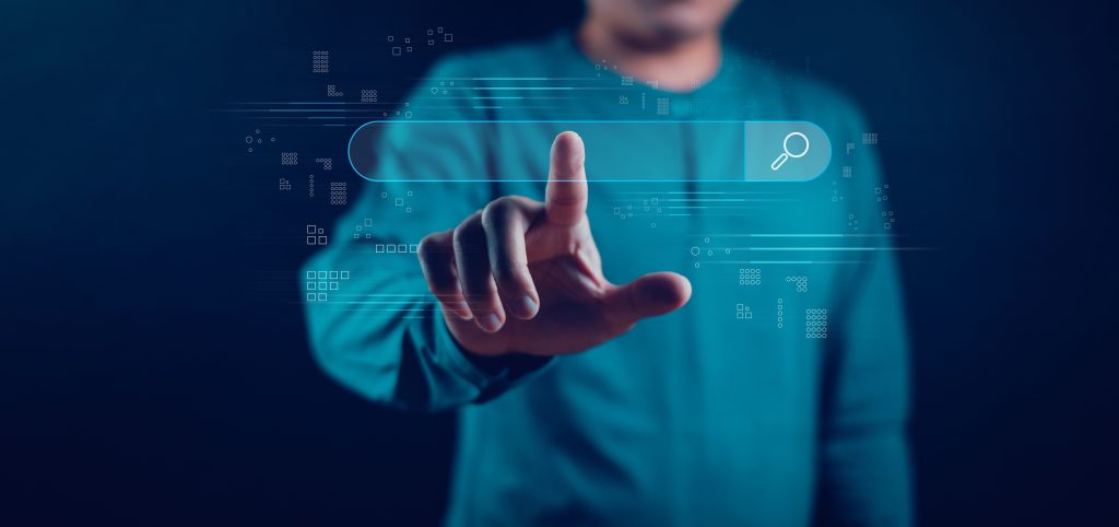 man touches search bar in this concept photo of the future of SEO with AI