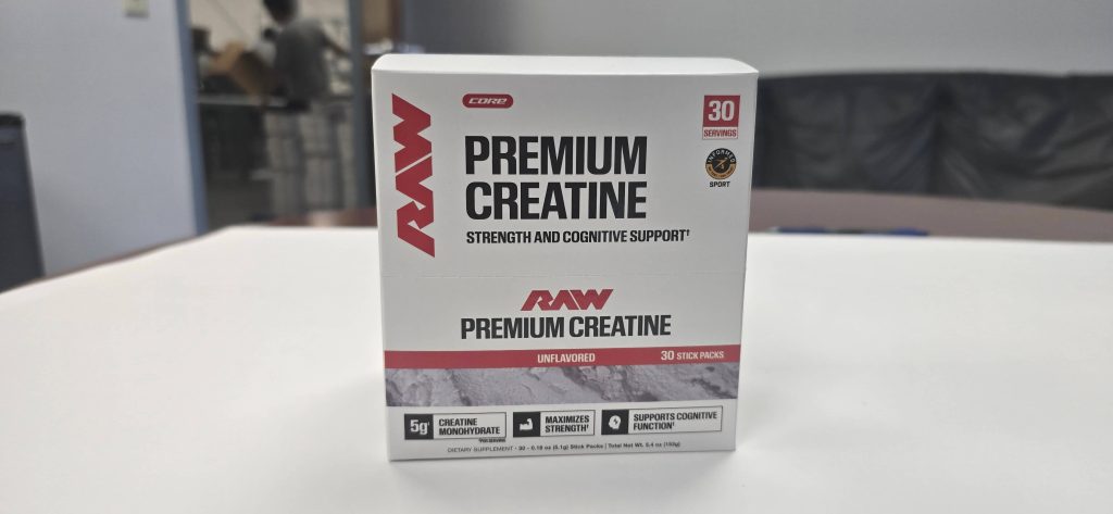 RAW Nutrition Premium Creatine display carton holding 30 unflavored stick packs, produced by Pak-Pro, a supplement packaging company