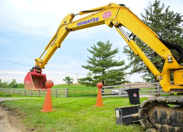 a person operating machinery in a heavy equipment trade school