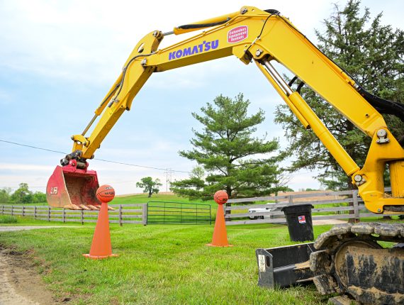 a person operating machinery in a heavy equipment trade school