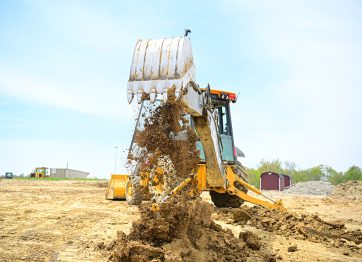 A piece of heavy equipment moving earth