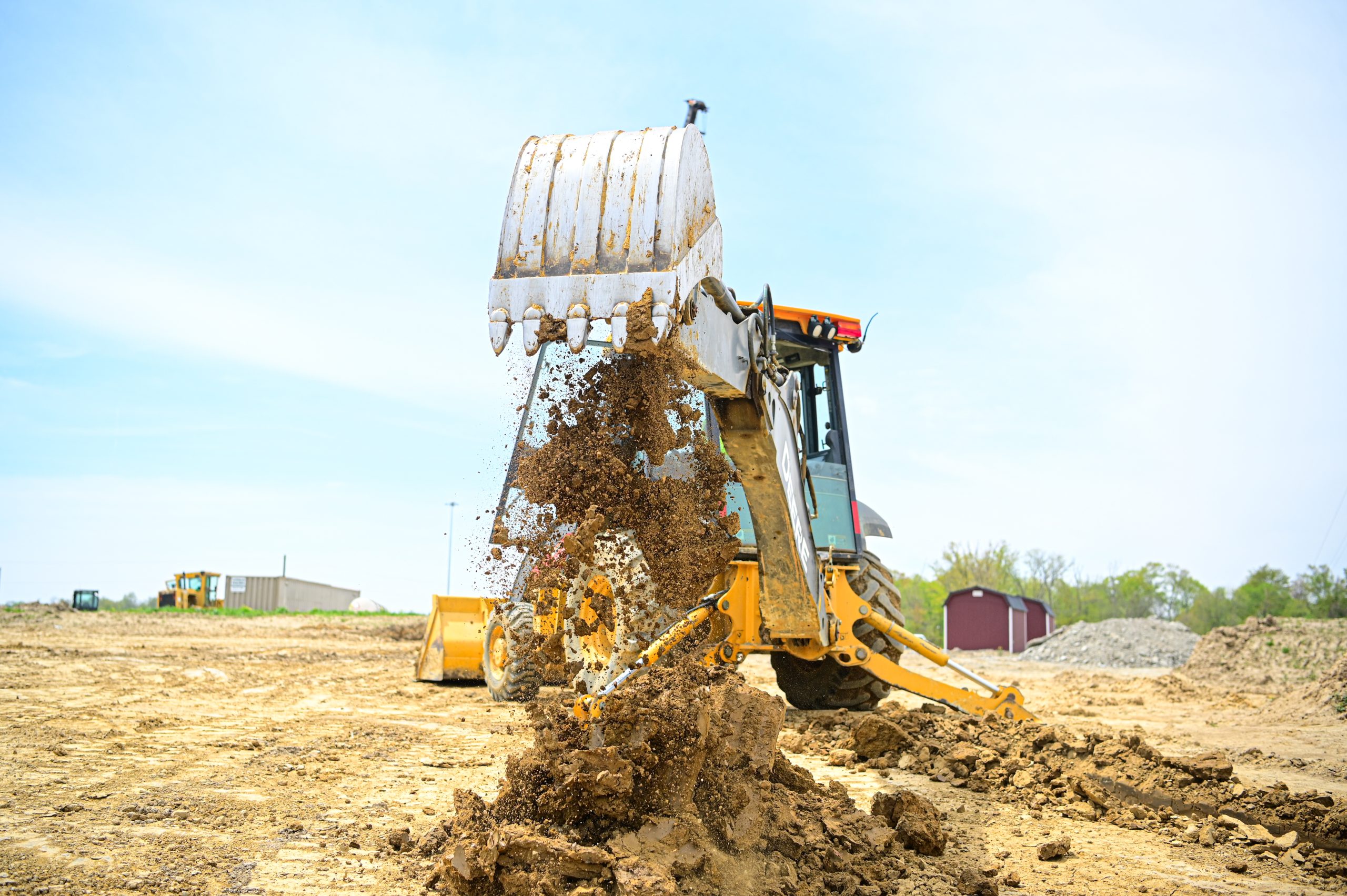 A piece of heavy equipment moving earth