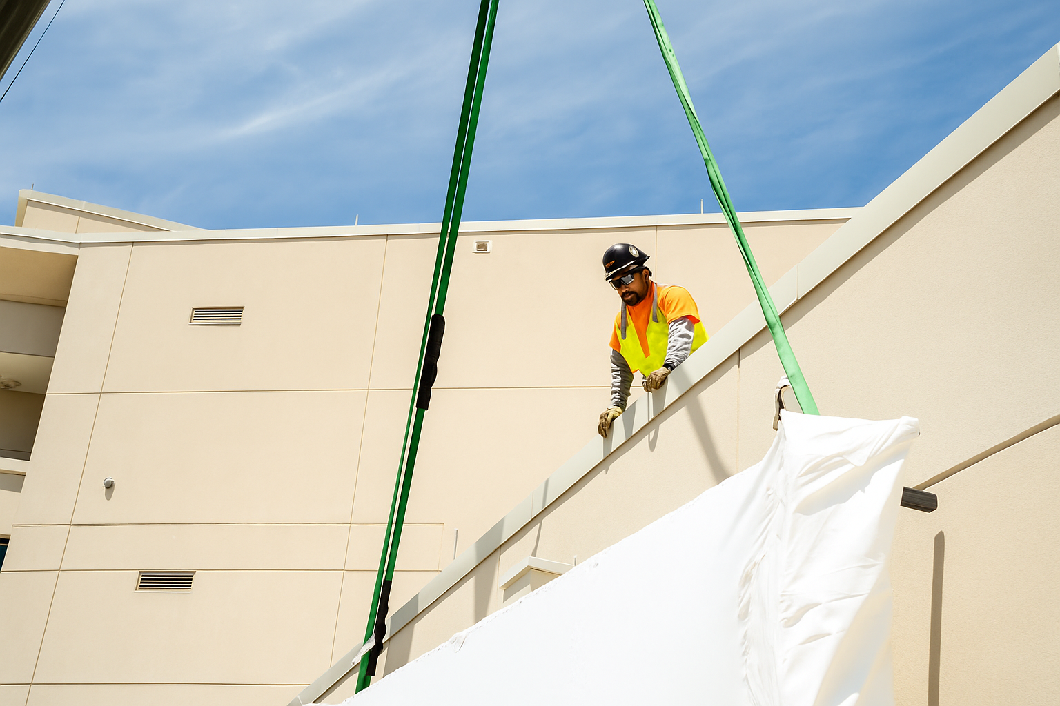 Worker Watching Sign Be Lifted